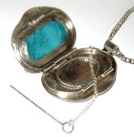 Silver locket with turquoise