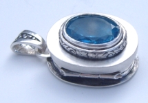 Silver locket with blue topaz